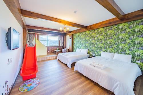 Cama o camas de una habitación en 清境英格曼花園民宿