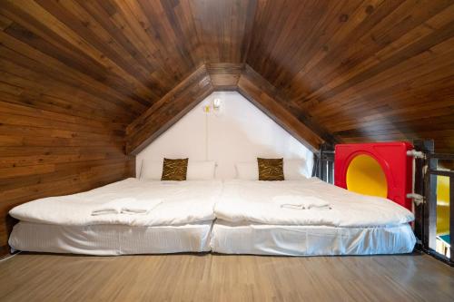 Cama o camas de una habitación en 清境英格曼花園民宿
