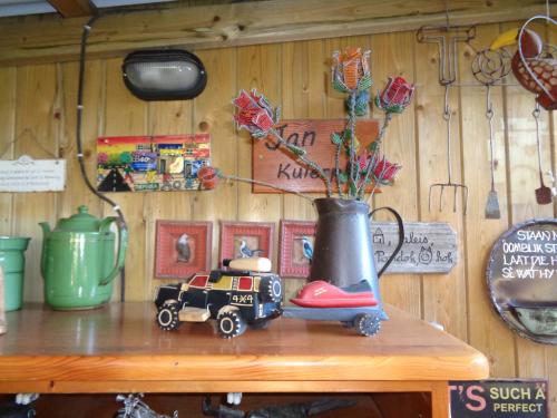 a toy truck sitting on a table with a vase at Oddingsplace in Hardenberg