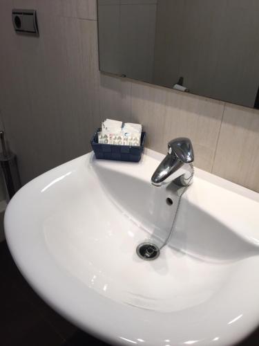 a bathroom sink with a faucet on top of it at Apolo in Benidorm