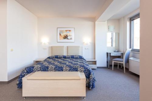 Postel nebo postele na pokoji v ubytování Neven Hotel