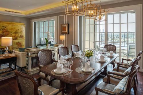 a dining room with a table and chairs at Mia Saigon – Luxury Boutique Hotel in Ho Chi Minh City