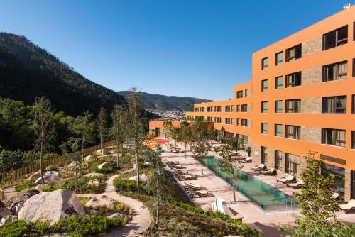 a view of a hotel with a pool and a resort at Vila Gale Serra da Estrela in Manteigas