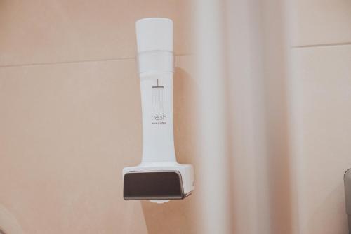 a remote control hanging on a wall at Hotel Silberfux in Sankt Veit im Pongau