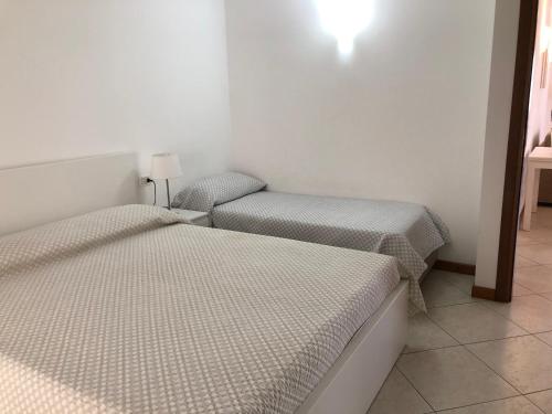Säng eller sängar i ett rum på Casa Grazia