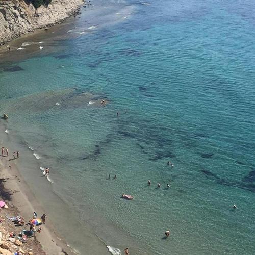 a group of people in the water at a beach at Apartamentos Santa Clara in Calpe