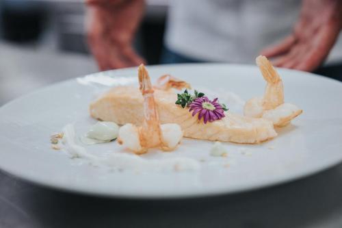 a white plate with some food on it at Hotel Silberfux in Sankt Veit im Pongau