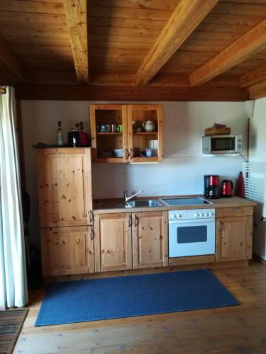 a kitchen with a sink and a stove at WUIL01001-FeWo-Studio in Wulfen auf Fehmarn