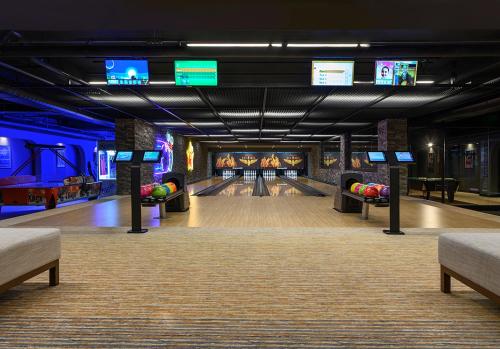 a bowling alley with lanes and televisions at Elite World Grand Sapanca in Sapanca