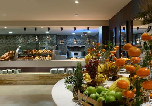 a store with a bunch of fruits and vegetables on display at Elite World Grand Sapanca in Sapanca