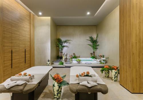 a living room with two tables and a bath tub at Elite World Grand Sapanca in Sapanca