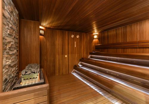 an empty sauna with wooden walls and wooden floors at Elite World Grand Sapanca in Sapanca