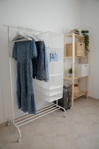 a room with a rack with clothes on it at Casa di Felicita in Biograd na Moru