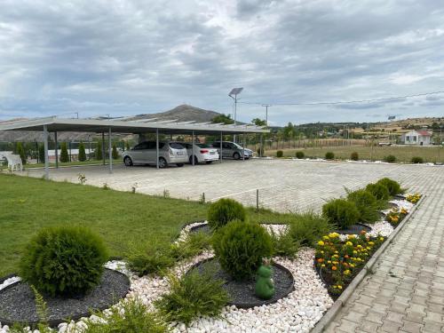 a parking lot with cars parked in a parking lot at Kostovski Rooms-near E75 to Greece in Veles