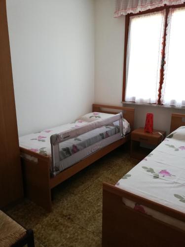 מיטה או מיטות בחדר ב-Villa Manuela