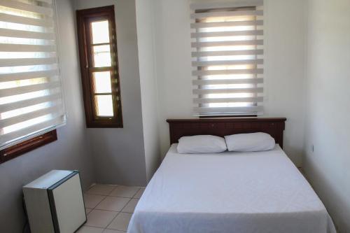 Ένα ή περισσότερα κρεβάτια σε δωμάτιο στο White City Pension