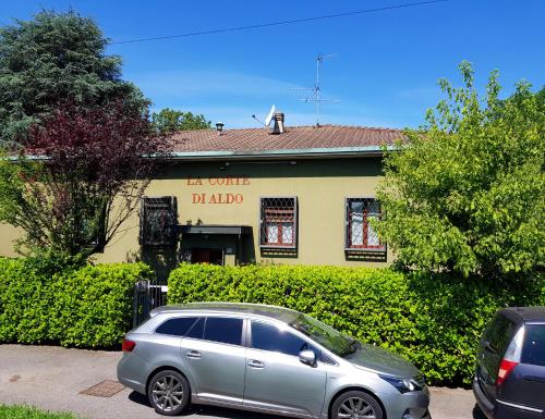 a silver car parked in front of a building at La Corte di Aldo in Rozzano