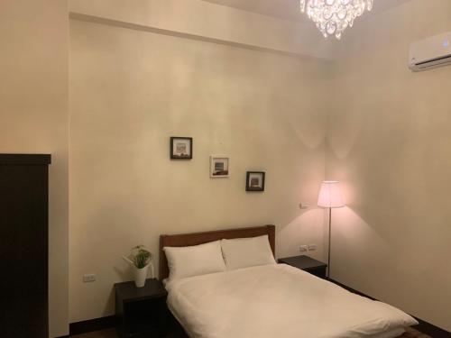 Postel nebo postele na pokoji v ubytování Puli Station Homestay