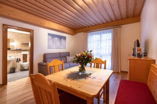 a living room with a table and a couch at Biochalet Märkl in Bad Kleinkirchheim