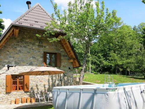 a bath tub in front of a stone house at Holiday Home Il Casello by Interhome in Sillano