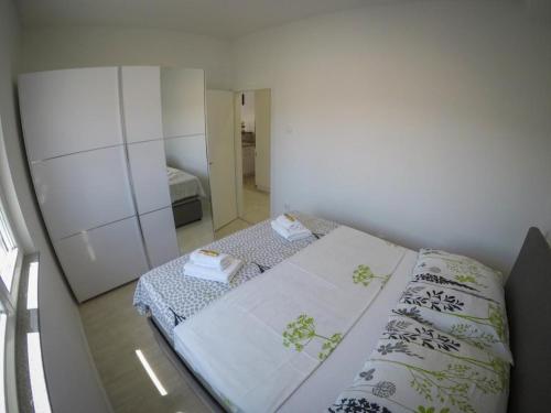 Postel nebo postele na pokoji v ubytování Apartments Tila