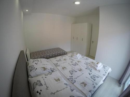 Postel nebo postele na pokoji v ubytování Apartments Tila