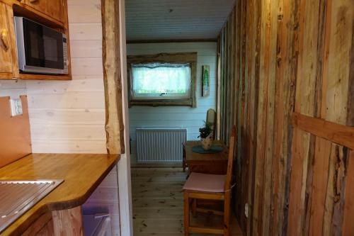 a small kitchen with a table and a window at Kulppis Bed&Breakfast in Härryda