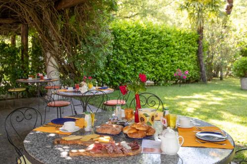 a table with bread and food on top of it at Hotel al Ponte Antico in Intragna