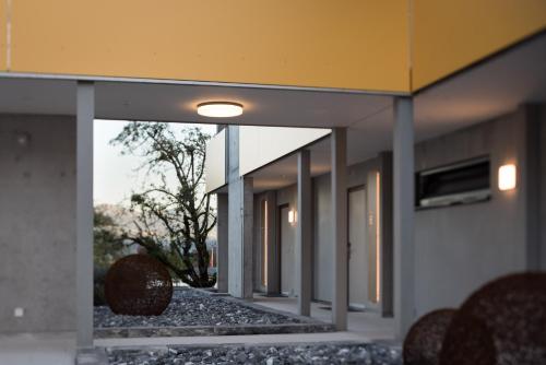 a row of mirrors on the side of a building at wohnMOTEL - Hinterforst in Altstätten