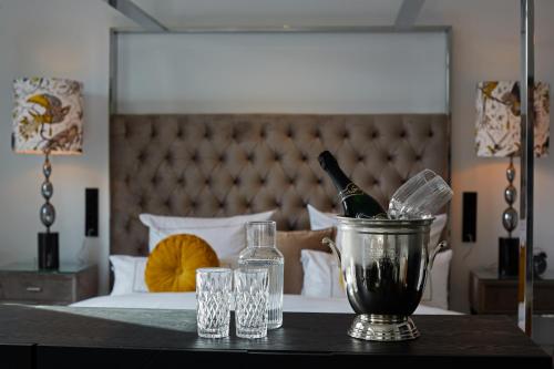 a table with a bucket of wine bottles and glasses at hotel friends Essen Zeche Zollverein in Essen