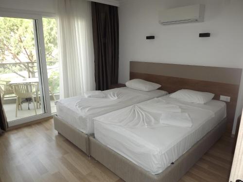 Säng eller sängar i ett rum på Opus Apart Hotel