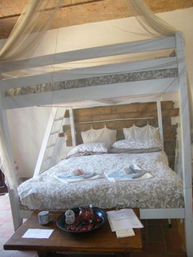 a bedroom with a bunk bed with a tray of food on a table at Casolare Casa Ricci in Riotorto