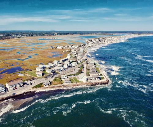 an aerial view of a beach and the ocean at Moody's Motel and Cottages in Wells