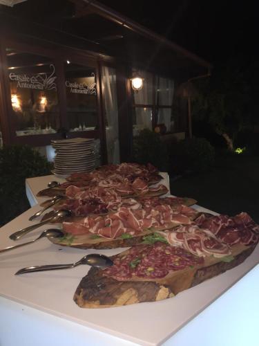 a table with three slices of pizza on a plate at Casale Antonietta in Sorrento