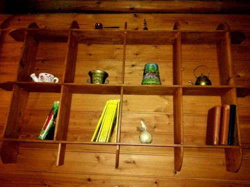 a wooden shelf with various items on it at CHALET IL GELSOMINO DELL'ETNA in Giarre
