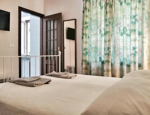 Villa Belvedere Langhe tesisinde bir odada yatak veya yataklar