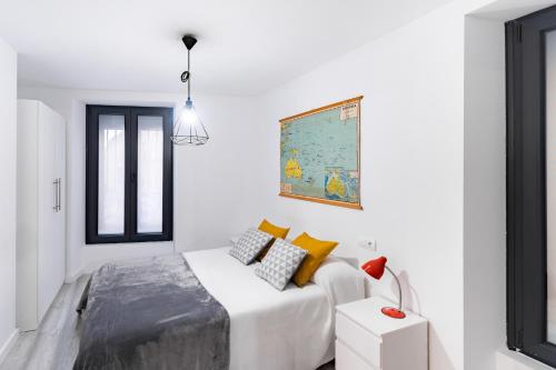 Ένα ή περισσότερα κρεβάτια σε δωμάτιο στο Housingleón - Nama Plaza Mayor