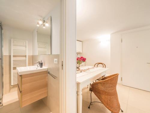 a bathroom with a sink and a mirror at Sweet Studio IN GIARDINO in Padova