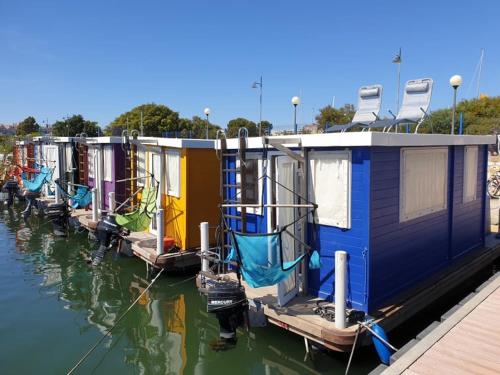 a row of houses are lined up in the water at HouseBoat Cagliari in Cagliari