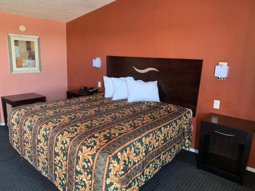 Postel nebo postele na pokoji v ubytování Royal Inn Borger