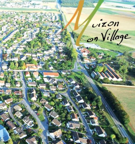 an aerial view of a city with houses and roads at Les quatre vents in Muizon