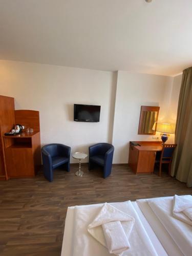 En eller flere senge i et værelse på Hotel Atrium Charlottenburg