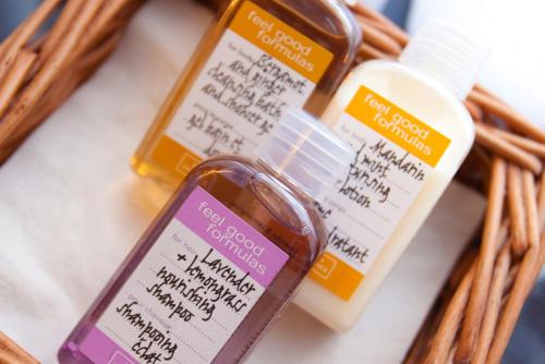 a group of three bottles of sunscreen in a wicker basket at Burt's Hotel in Melrose