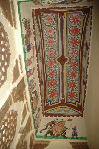 a painting on the ceiling of a room at Kasera Paradise in Būndi