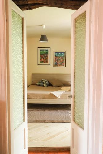 a door leading into a bedroom with a bed at Rivacanze Apartments in Laglio