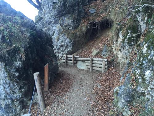 a wooden fence on the side of a mountain at Suite Romantica Fuga in Roncone