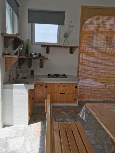 a kitchen with a sink and a counter top at House Katarina in Ankaran