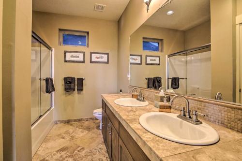 a bathroom with two sinks and a mirror at Luxe Coastal Haven with Bay Views and Hot Tub in Bay City