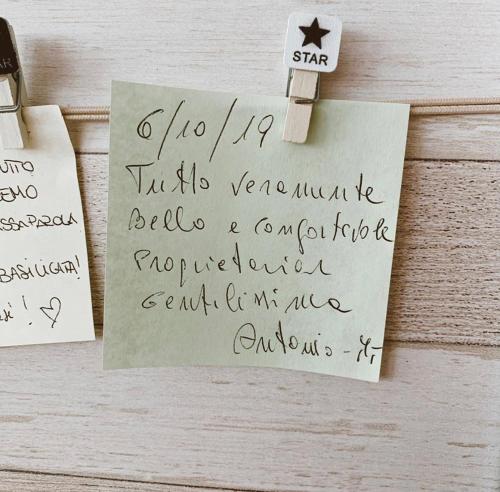 a piece of paper with writing on it on a table at Tempio Aurora in San Costantino Albanese