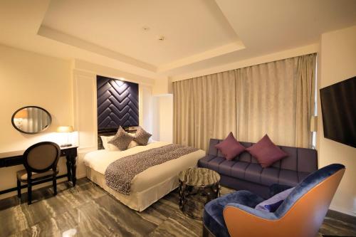 Ένα ή περισσότερα κρεβάτια σε δωμάτιο στο Centurion Hotel Residential Akasaka Station